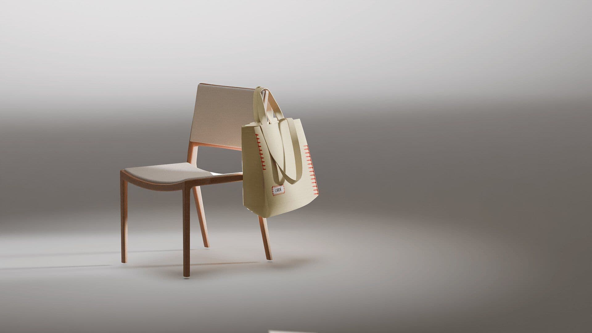 Tote hanging on a wooden chair in soft grey light
