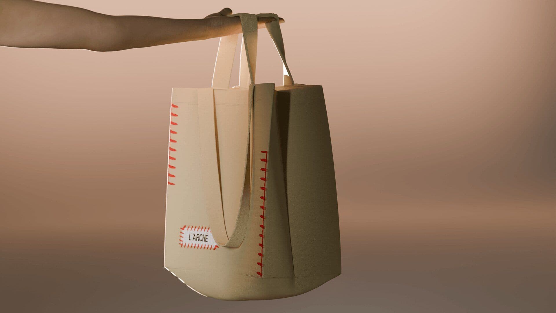 Tote held by an outstretched arm on a warm peach background