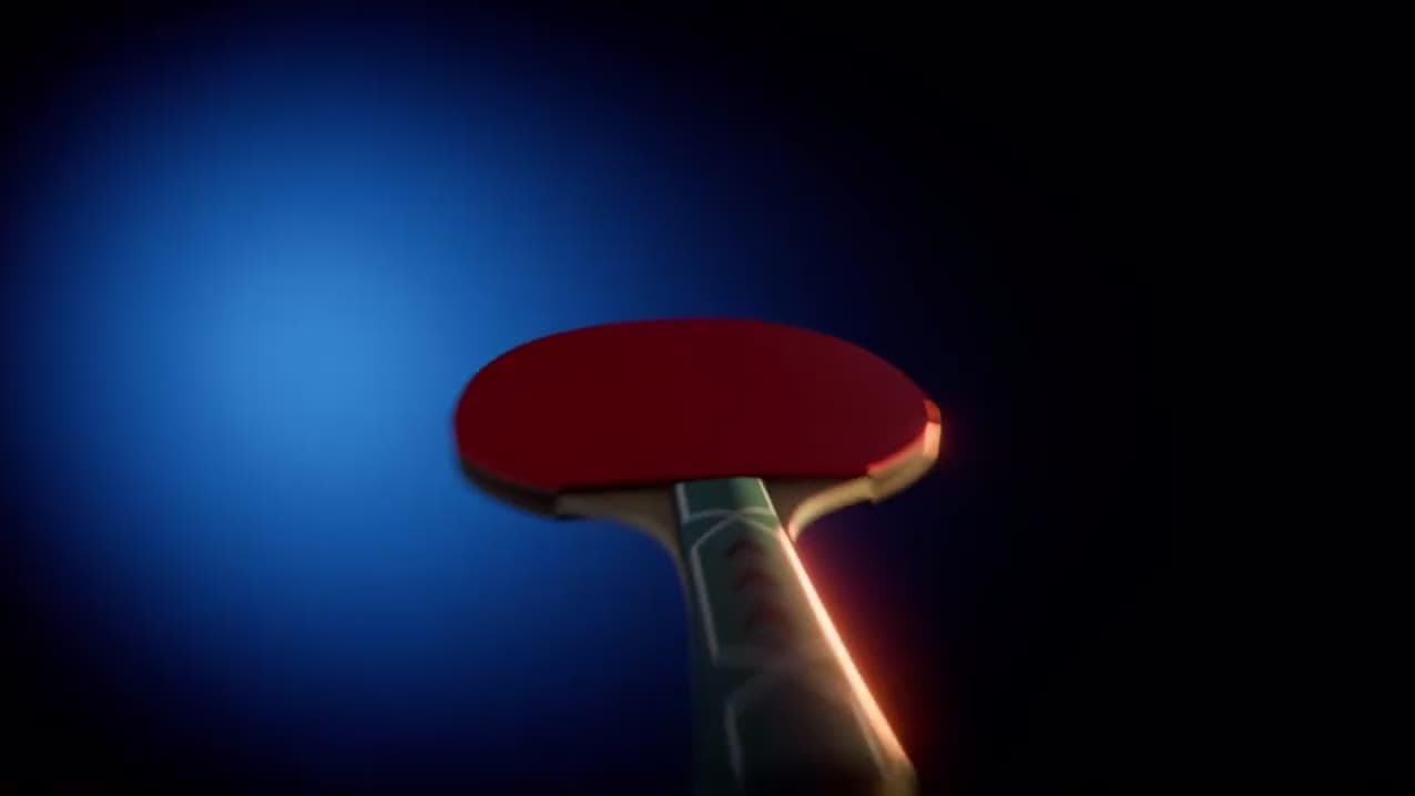 Red paddle falling through blue light